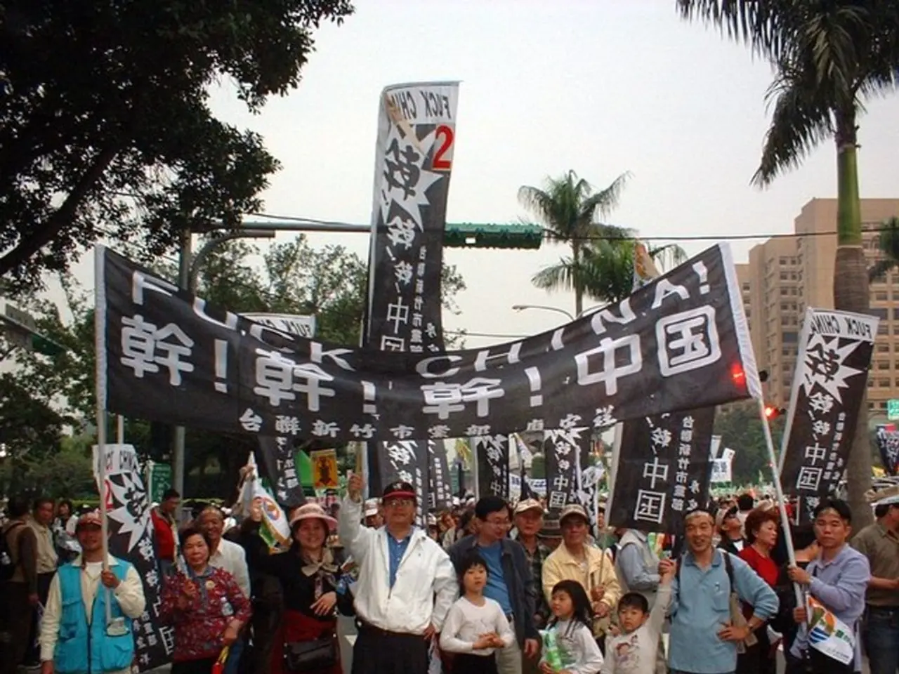 Riders in the Vuelta cycling race pass by with Palestinian flags waving overhead