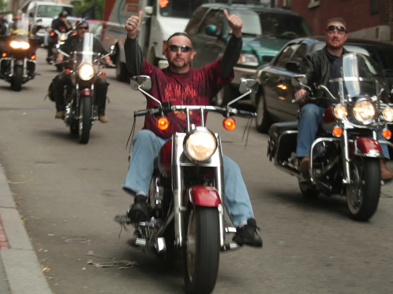 Biker collides with a BMW on busy road, flees the scene.