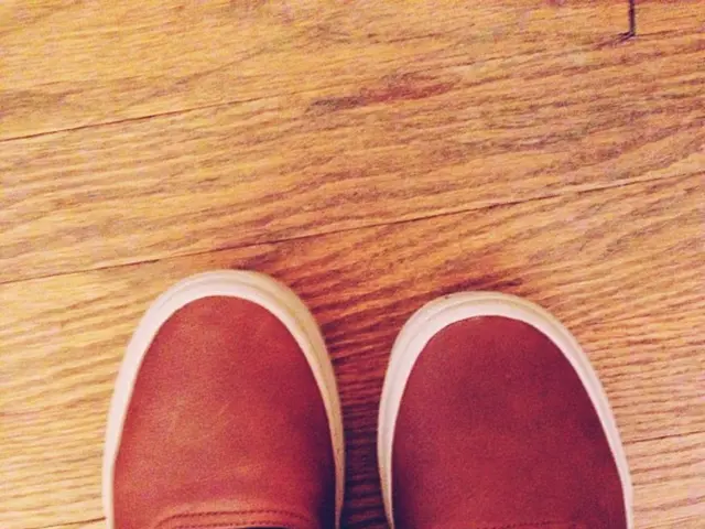 Casual outfit consisting of track pants, a muscle tank, and chunky heels