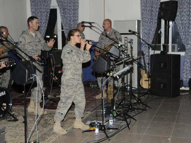 In this picture we can see a group of people in the army dresses. Some people holding the musical...